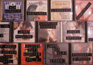 Image of CD cases with raised letter labels on them